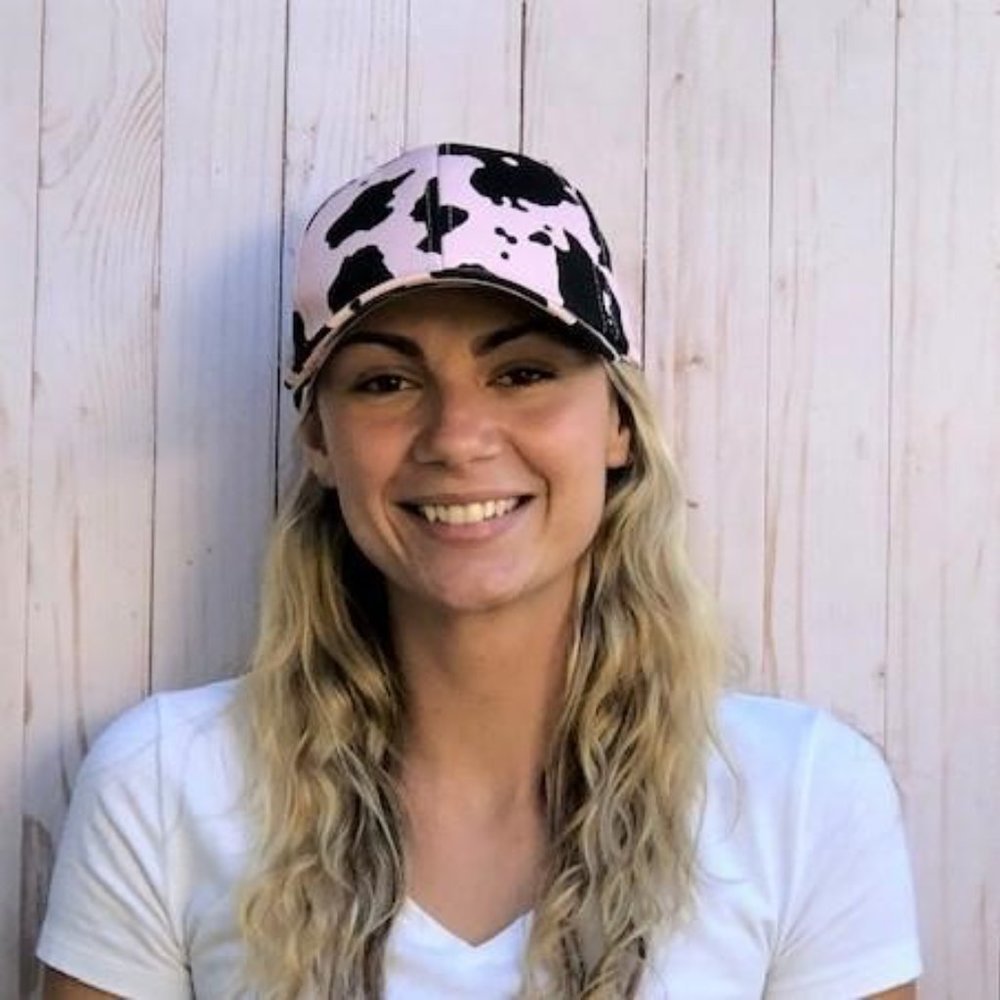 Pink and black cow print baseball cap